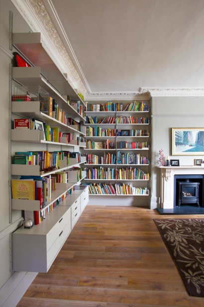 A dado rail and picture rail might cause you to think twice but three separate tracks allow the 606 Universal Shelving System to solve the problem.