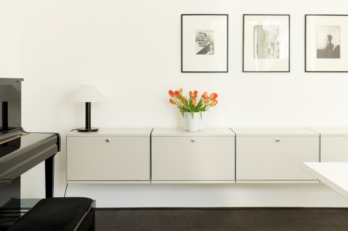A simple arrangement of fold-down-door cabinets is a secure sideboard for any room.