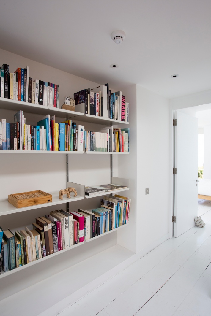 Even a hallway recess can accommodate the books and games. Our planning team can advise how best to use awkward spaces