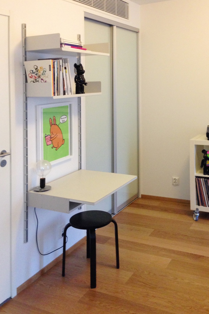 A desk shelf provides the perch for homework