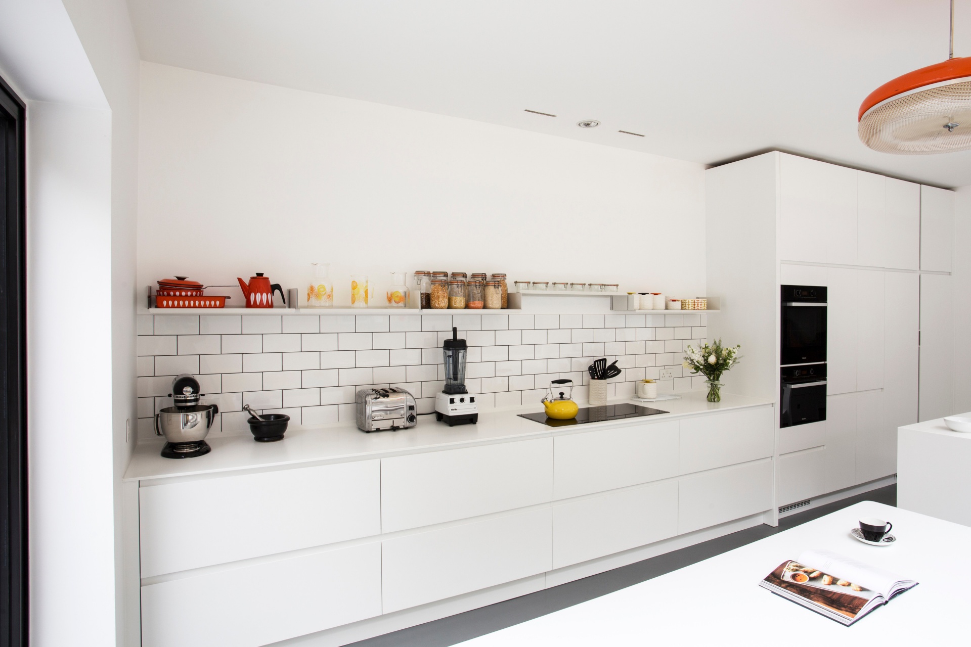 Modern kitchen open top shelves, wall mounted pantry staples storage, kitchenware display, minimalist design. Modular Vitsœ 606 Shelving System. Designer shelves, Dieter Rams