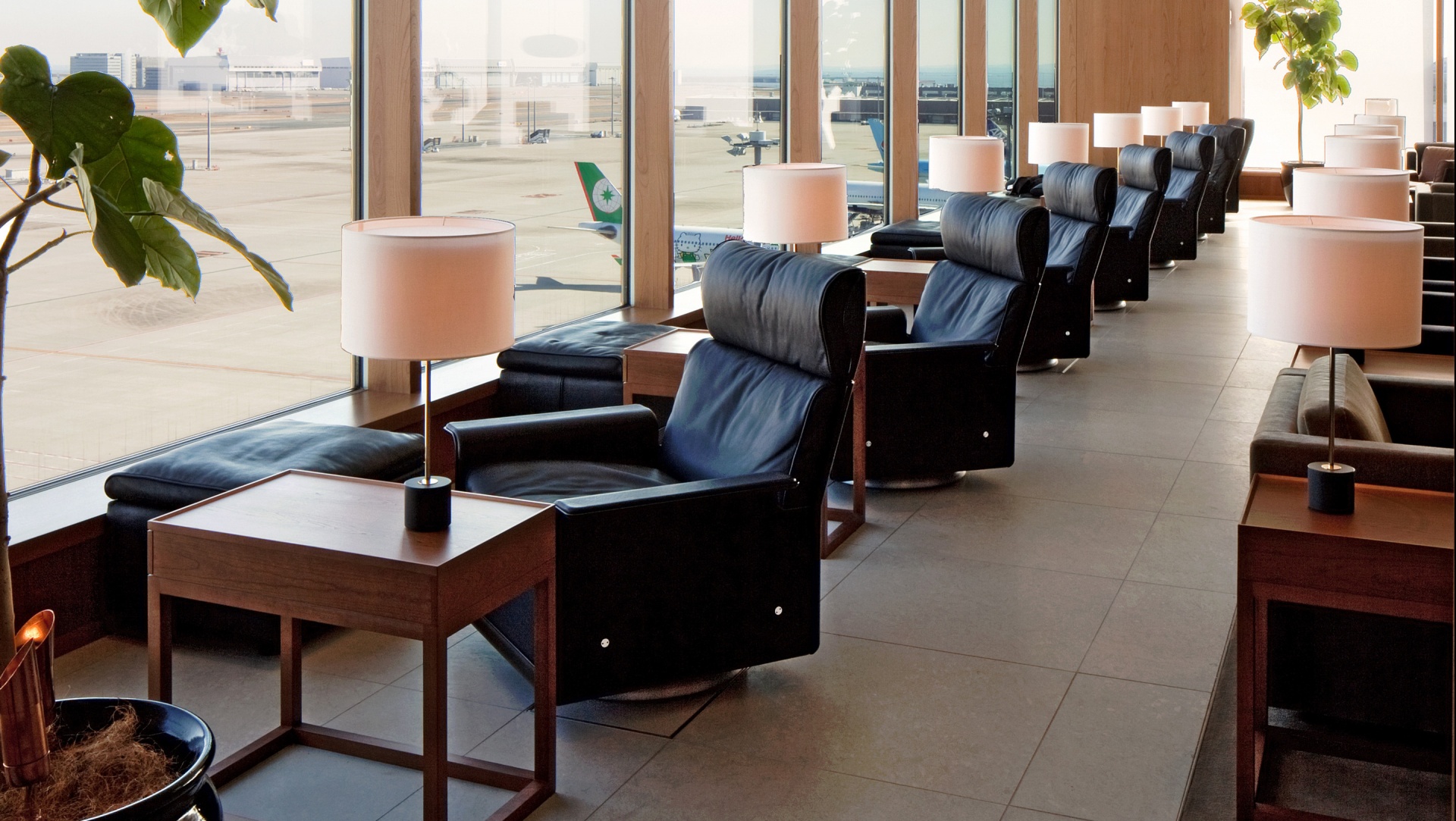 A bank of high-back 620 chairs with swivels and footstools await discerning travellers