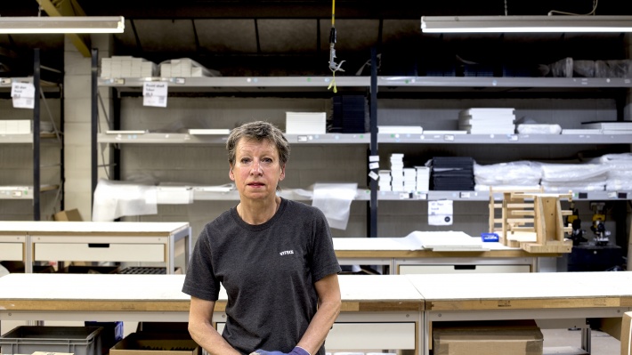 Sandy at the 606 Universal Shelving System cabinet assembly area of the Vitsœ workshop in 2017