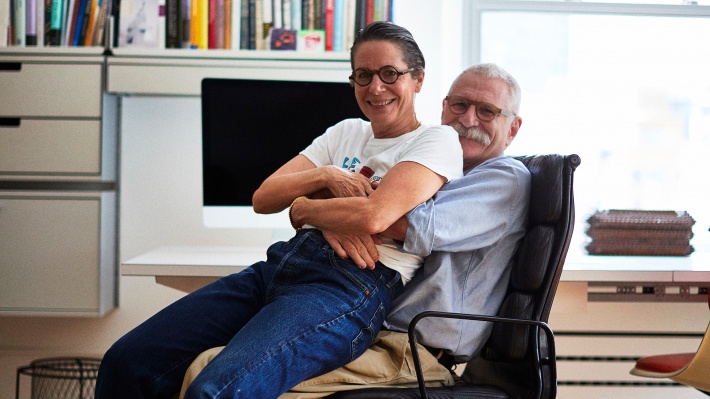 Sue and Alan Ravitz in front of the 606 Universal Shelving System in New York