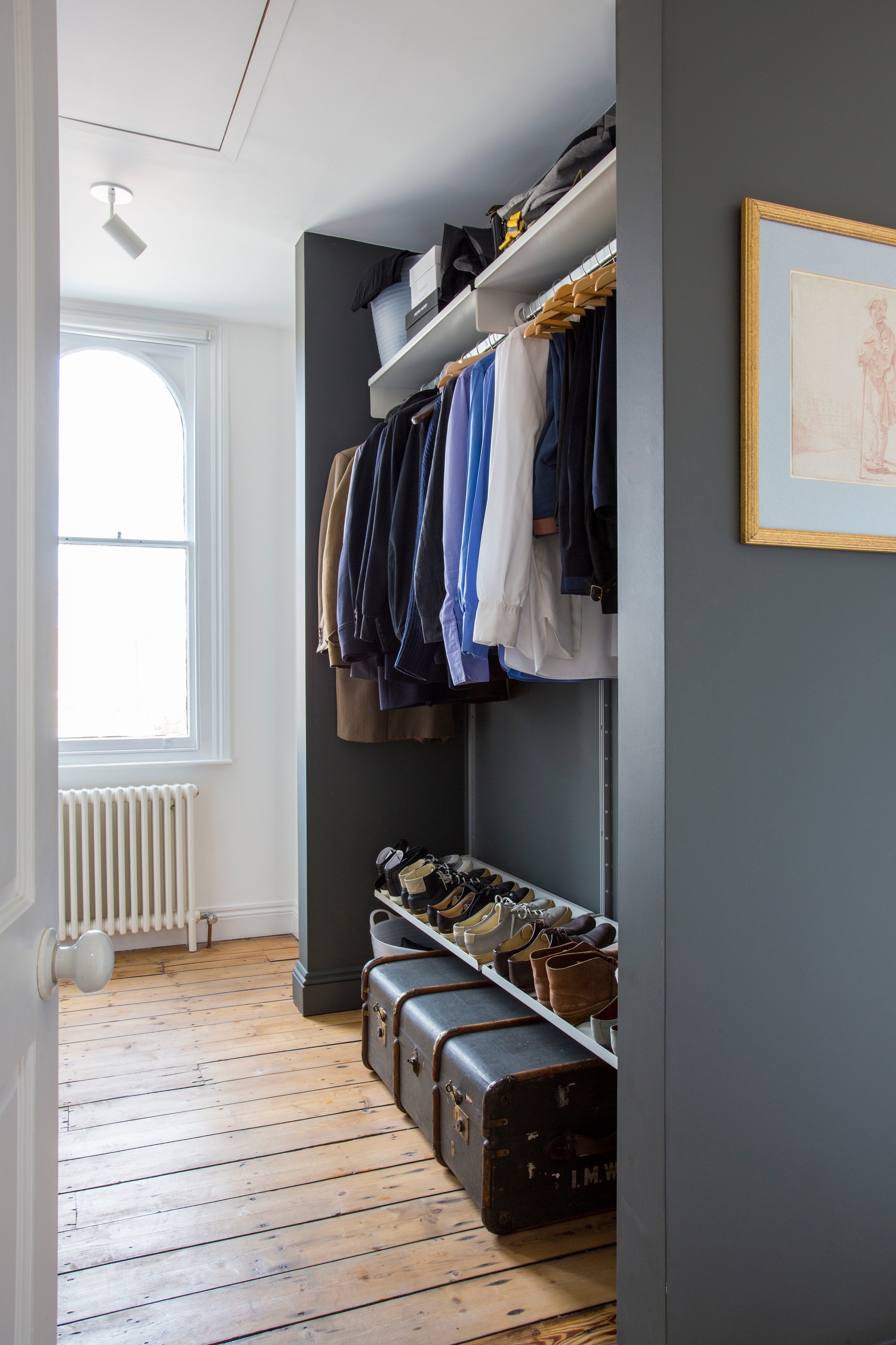 custom made open wardrobe system with shoe storage in alcove, bedroom. Strong clothes rail. Vitsœ modular 606 Shelving system, designer Dieter Rams.