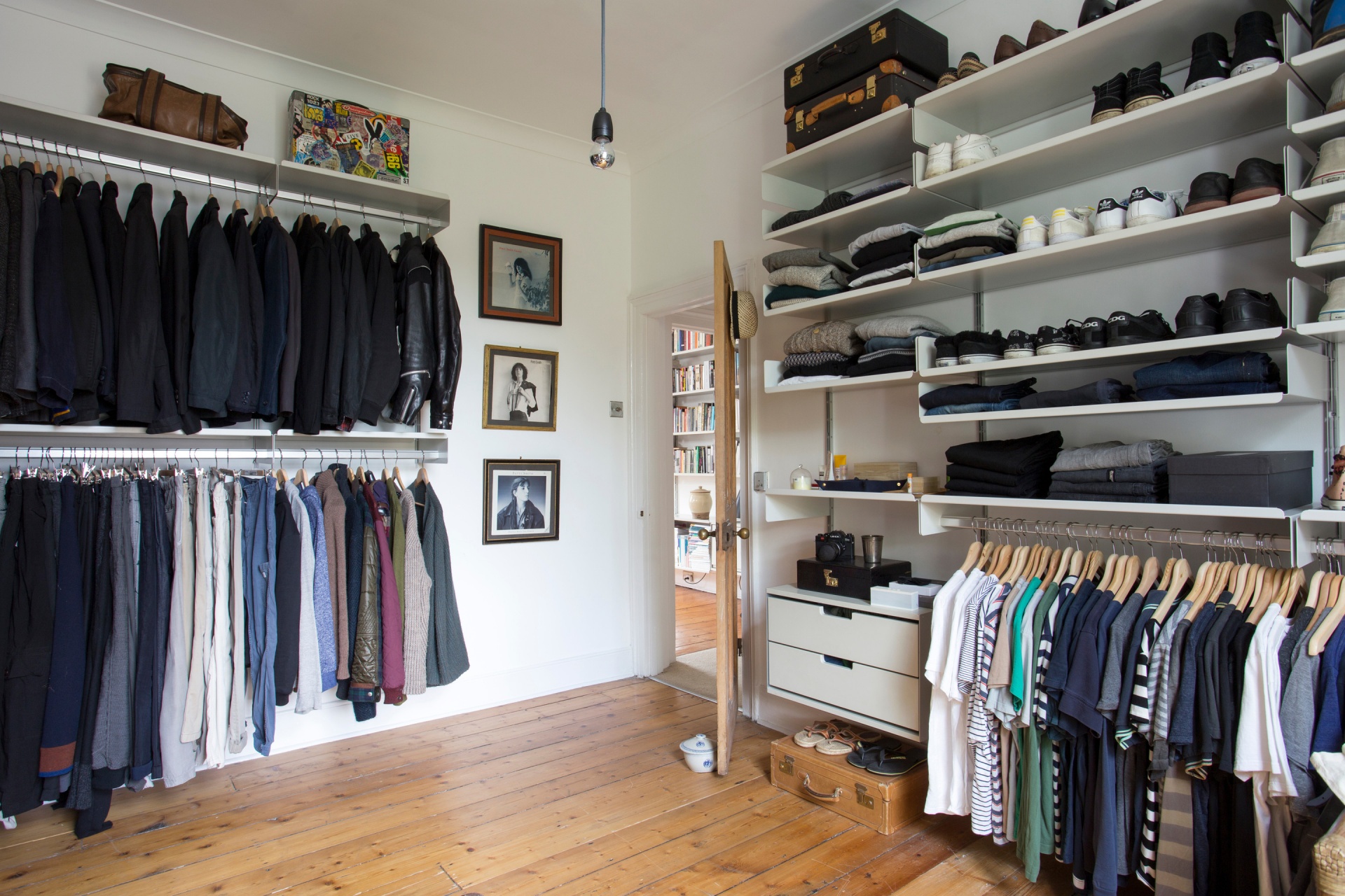 Custom made modern walk in closet. Bedroom open wardrobe system with shoe storage, shelves with strong clothes rail, drawer cabinets. Vitsœ modular 606 Shelving system, designer Dieter Rams.