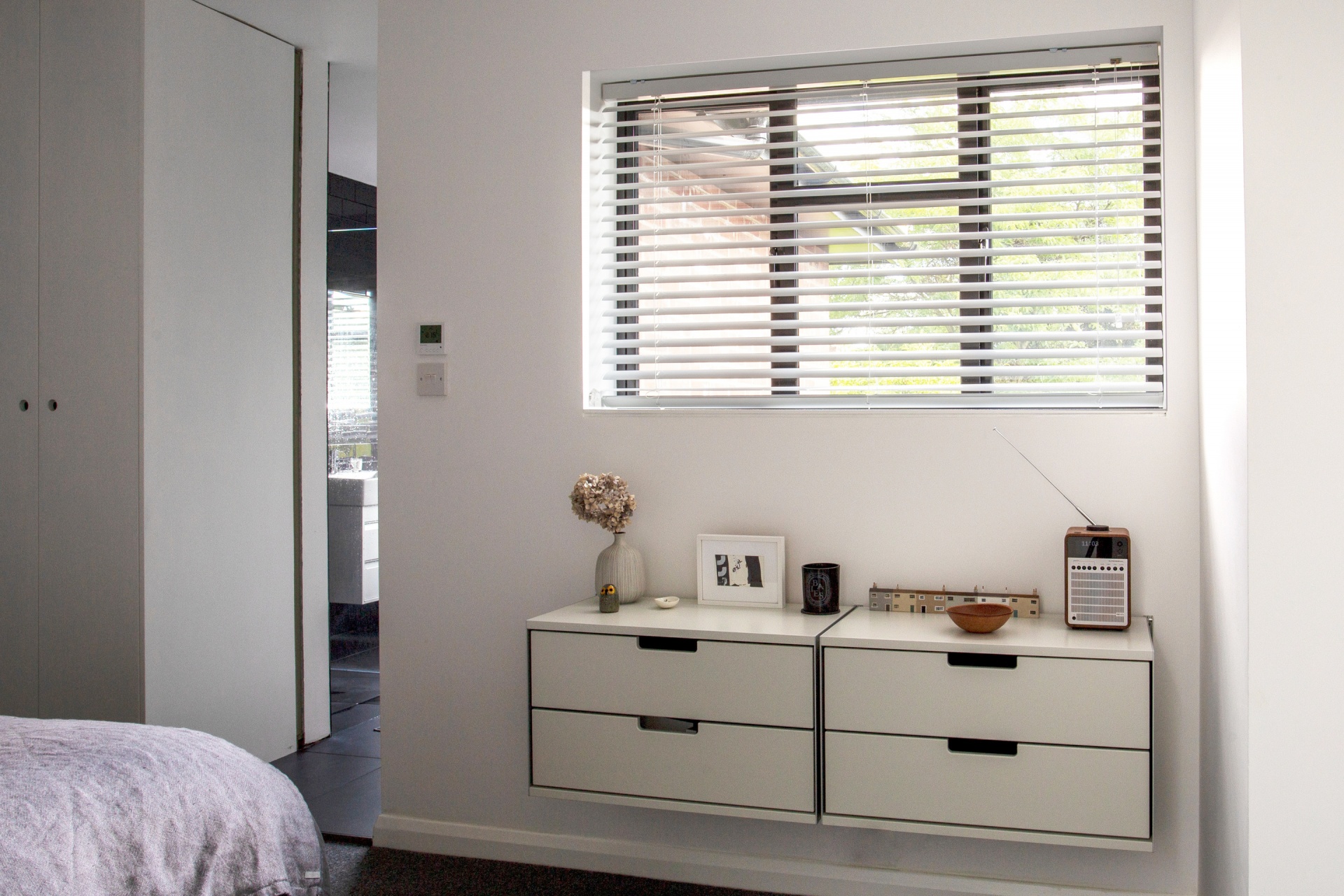 modern wall mounted dressing cabinet with drawers, off-white. Vitsœ modular 606 Shelving system, designer Dieter Rams.
