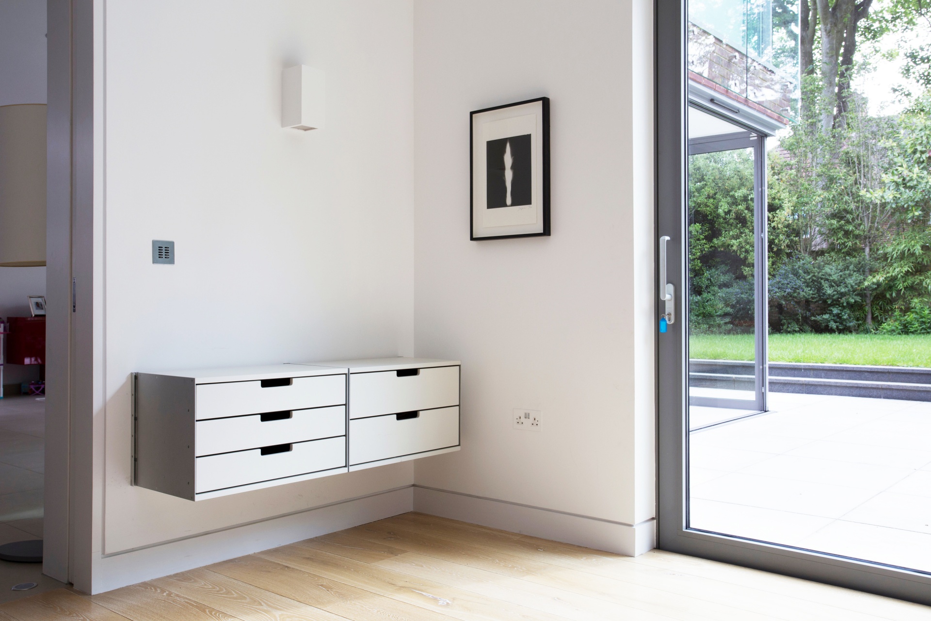 Hallway floating storage drawer cabinets. Wall mounted, minimalist. Modular 606 Shelving System. Designer, Dieter Rams. Vitsœ