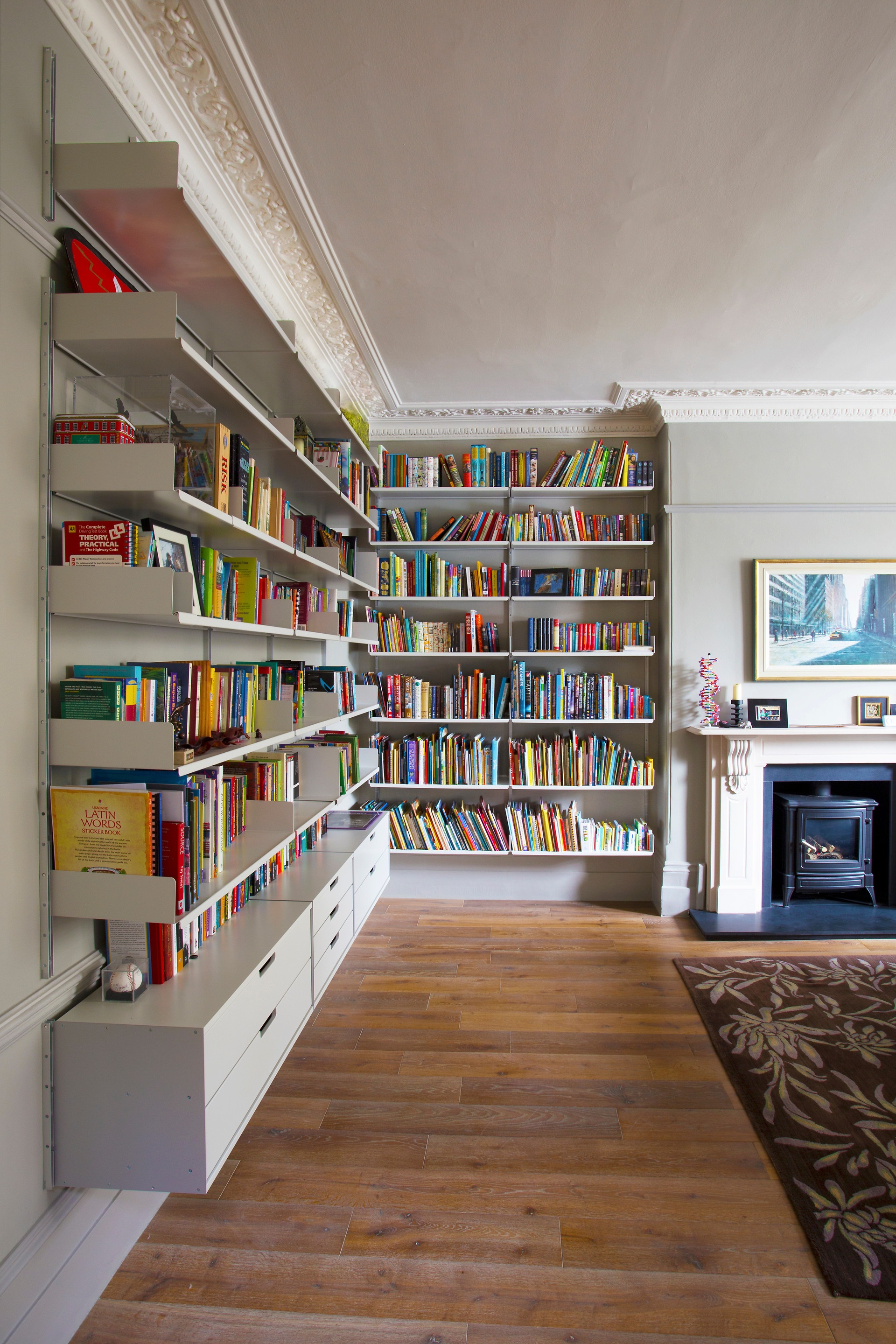 Floor to ceiling bookshelves. Wall mounted bookcases and filing cabinets. Large collection. Designer shelves, Dieter Rams. Vitsœ 606 Universal Modular Shelving System.