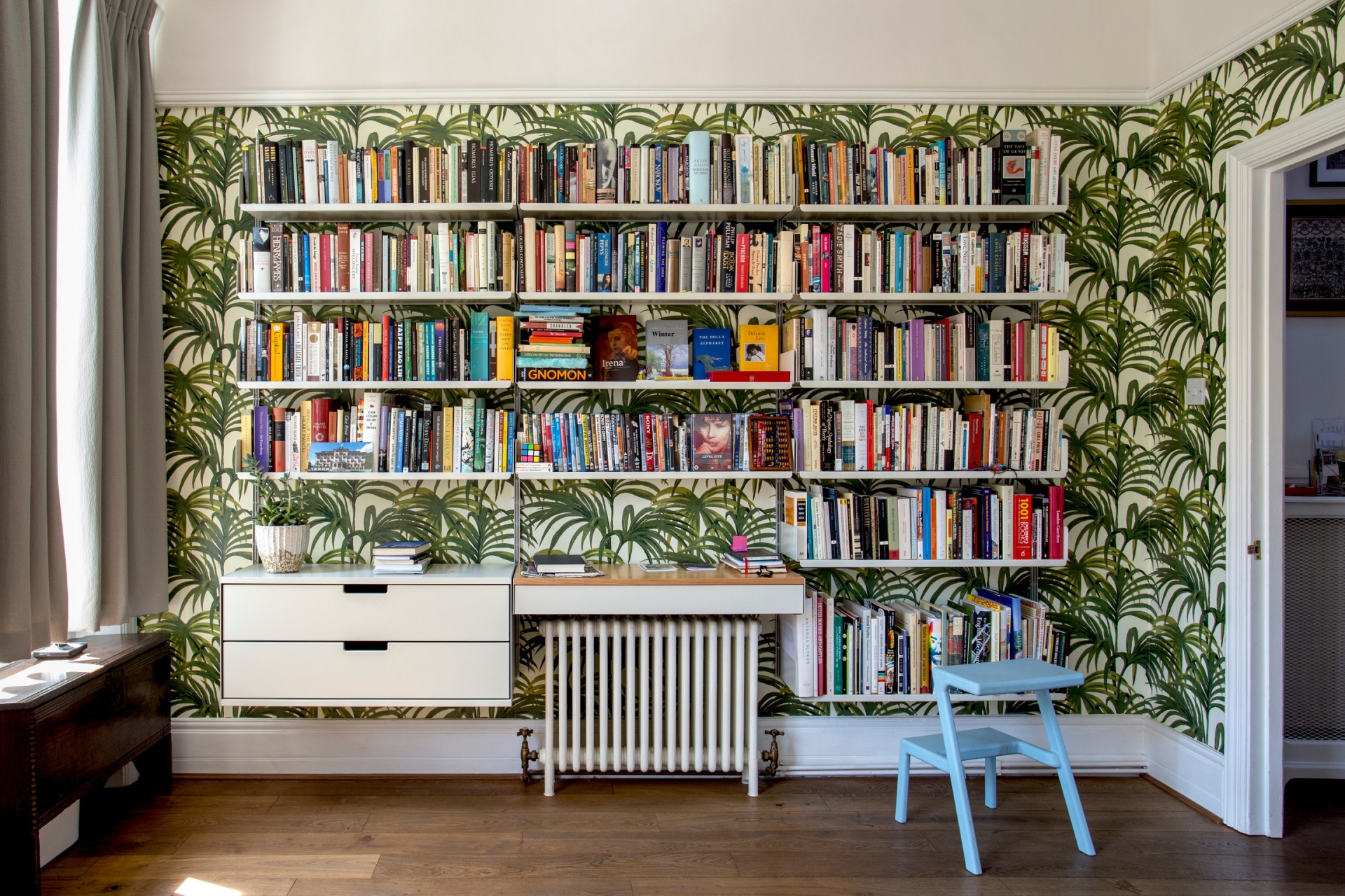 Floor to ceiling bookshelves. Wall mounted bookcases and filing cabinets. Strong metal shelves for heavy collection of books, study room. Designer shelves, Dieter Rams. Vitsœ 606 Universal Modular Shelving System.