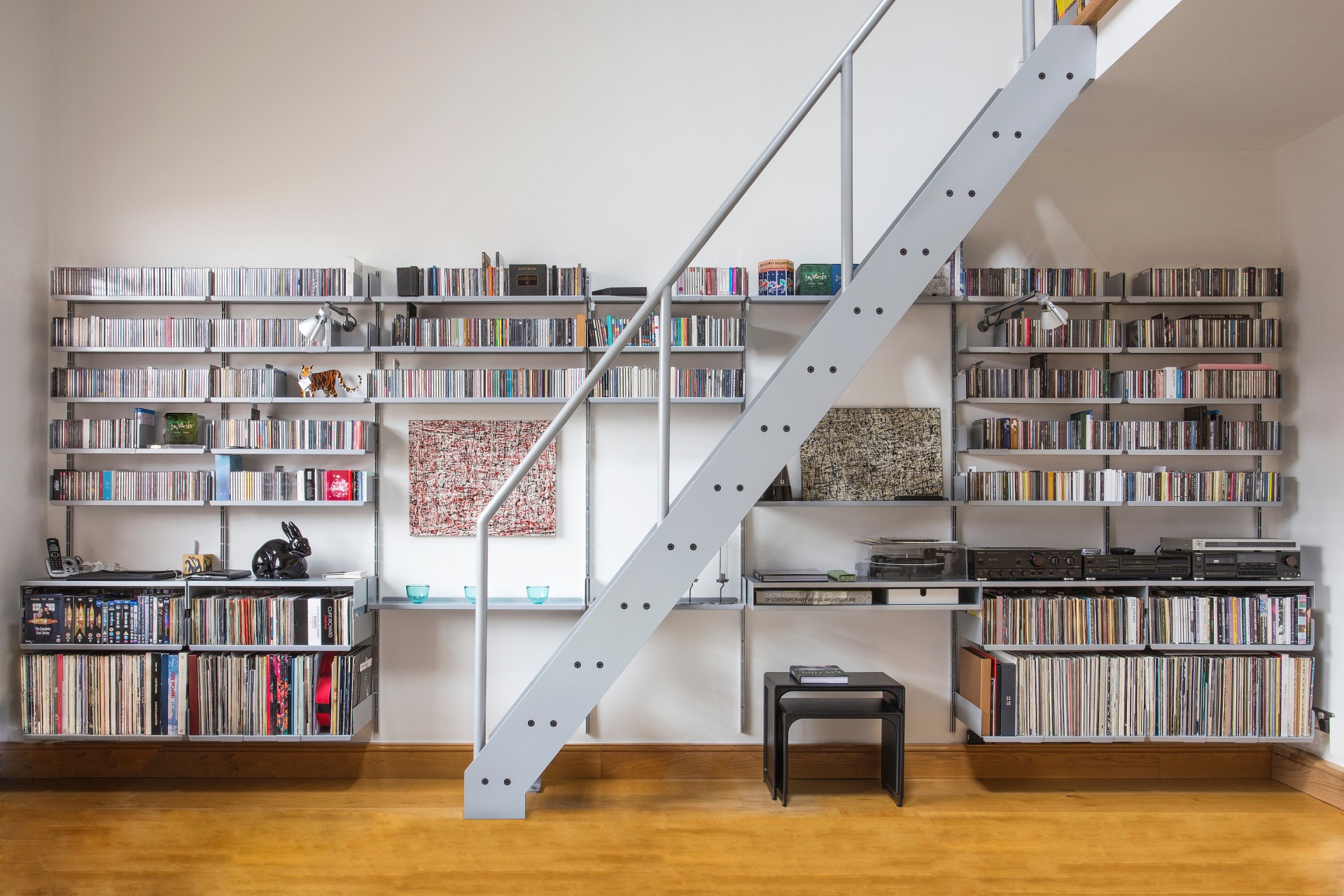 Vinyl records shelves, Hi-Fi rack for large LP collection. Media shelf long rows. Modular Vitsœ 606 shelving system. Designer Dieter Rams