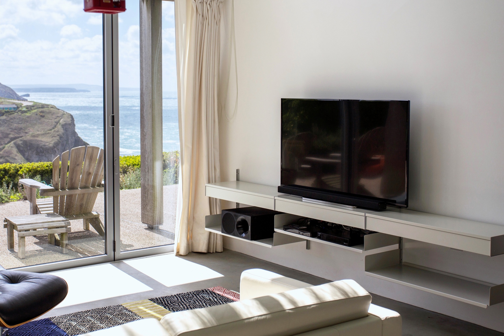 TV stand sideboard. Entertainment center and gaming. Modern modular 606 shelving system. Designer Dieter Rams. Vitsœ.