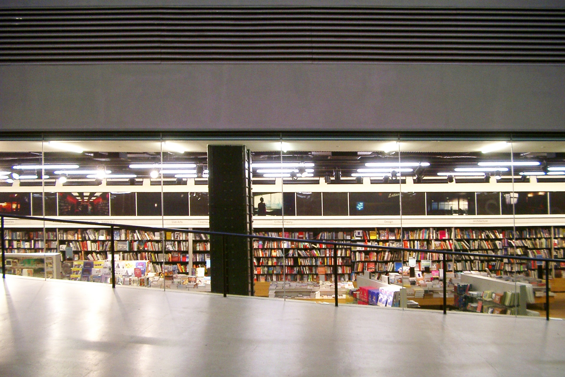 Museum library shelving. Modern wall mounted bookshelves. Modular Vitsœ 606 Universal Shelving System. Design Dieter Rams