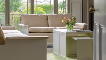 Modular sofa, 620 Chair. two-seater and and three-seater configuration in linen upholstery, flax colour. Versatile side table 621 used as a coffee/tea table for the living room