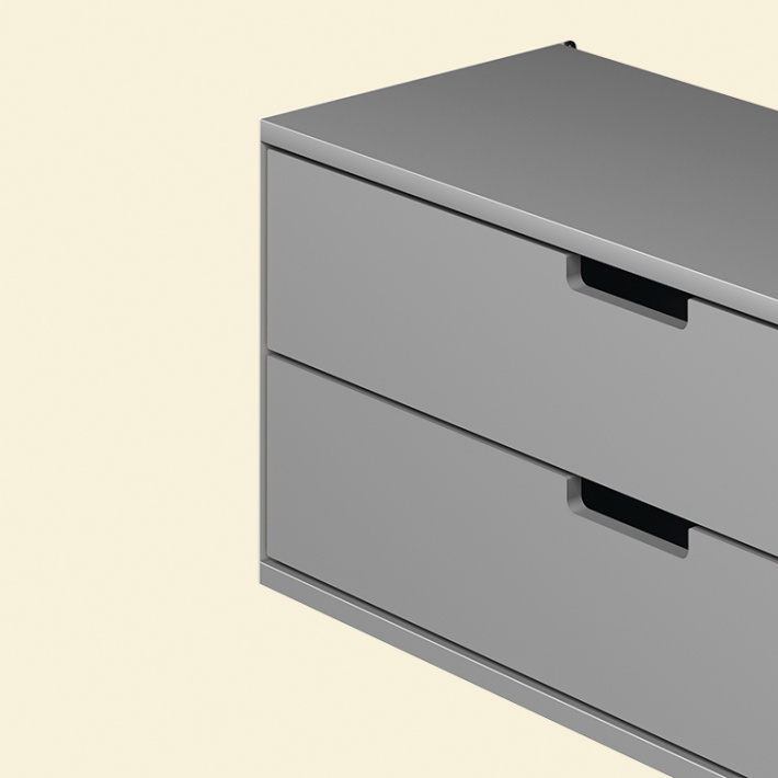 Two drawer cabinet. Vitsœ 606 shelving system, in silver. Dieter Rams design