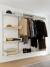 Vitsœ 606 Shelving with hanging rail in the hall