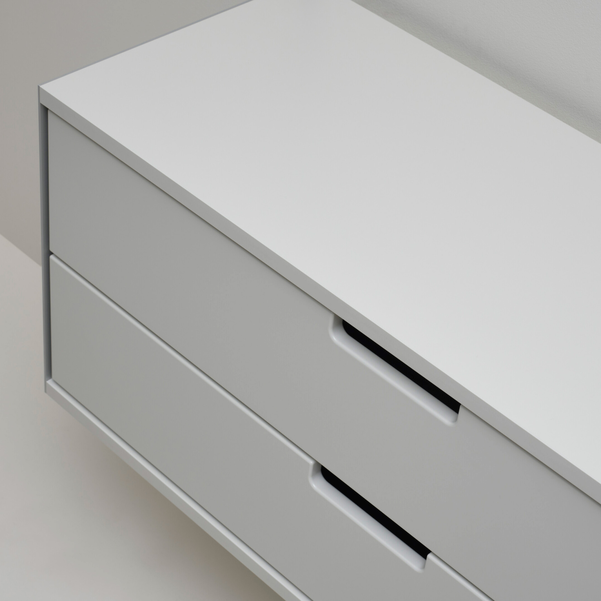 Two drawer cabinet. Vitsœ 606 shelving system, off white. Dieter Rams design