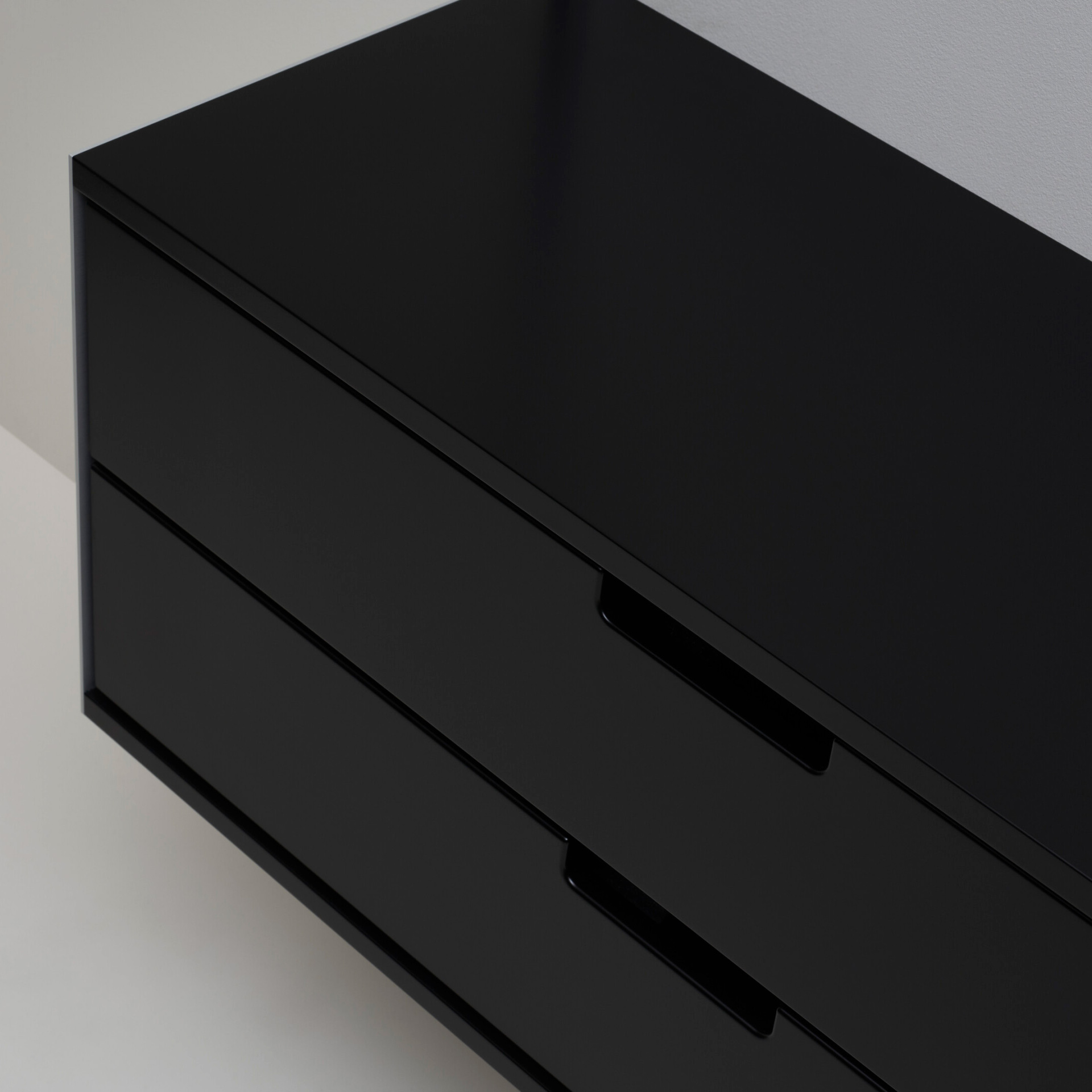 Two drawer cabinet. Vitsœ 606 shelving system, in black. Dieter Rams design