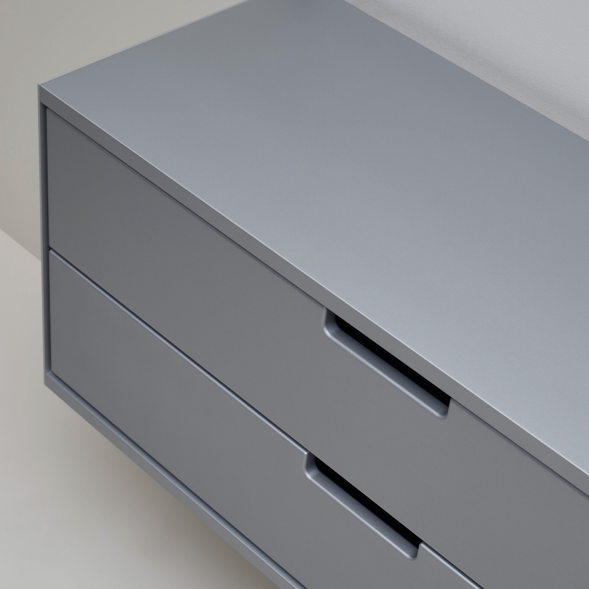 Two drawer cabinet. Vitsœ 606 shelving system, in silver. Dieter Rams design