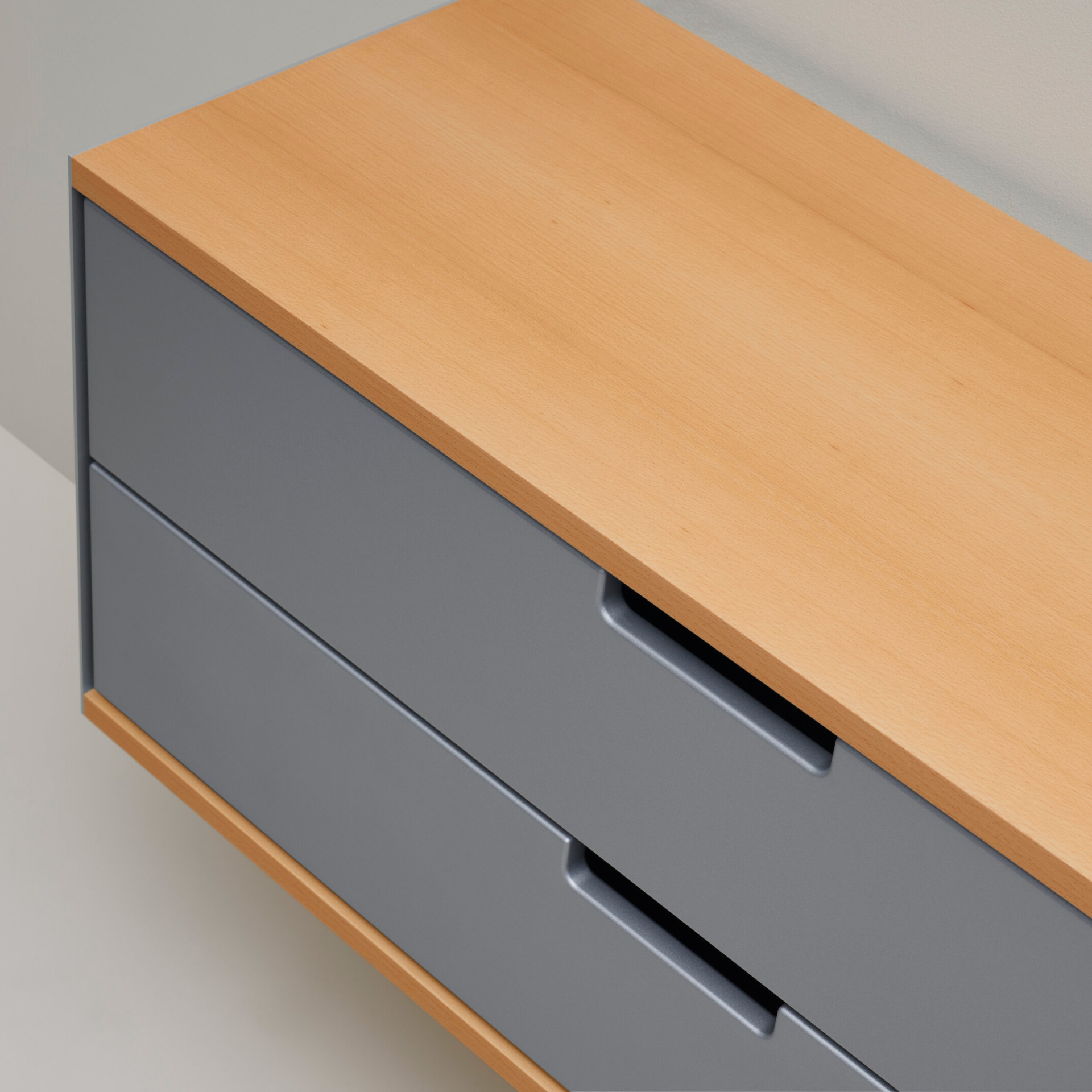 Two drawer cabinet. Vitsœ 606 shelving system, in silver and beech. Dieter Rams design
