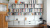 Vitsœ 606 Shelving System by Dieter Rams. Modular wall-mounted bookshelves with off-white shelves.