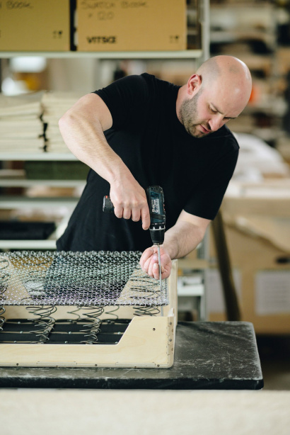 Vitsœ employee preparing the 620 Chair base in the production building, Royal Leamington Spa, UK