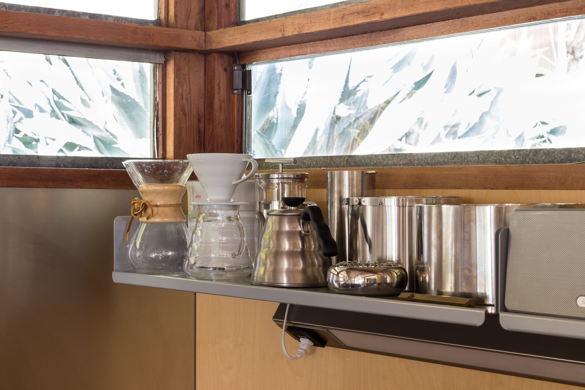 Single shelf for coffee kit in the kitchen. Silver colour.