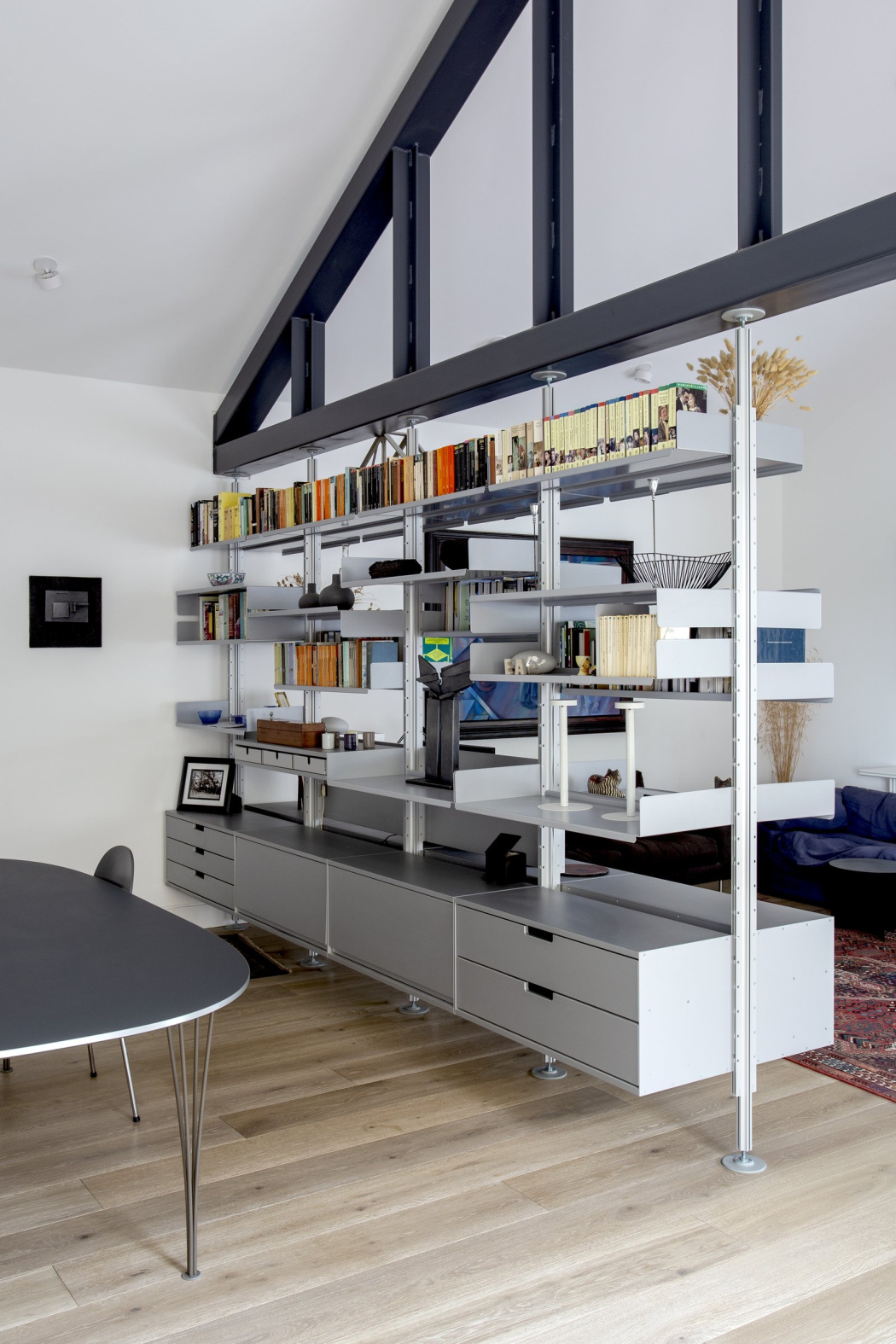shelving system used as room divider in the living room